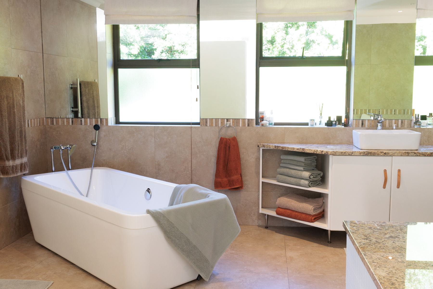 Main bathroom with a freestanding bath