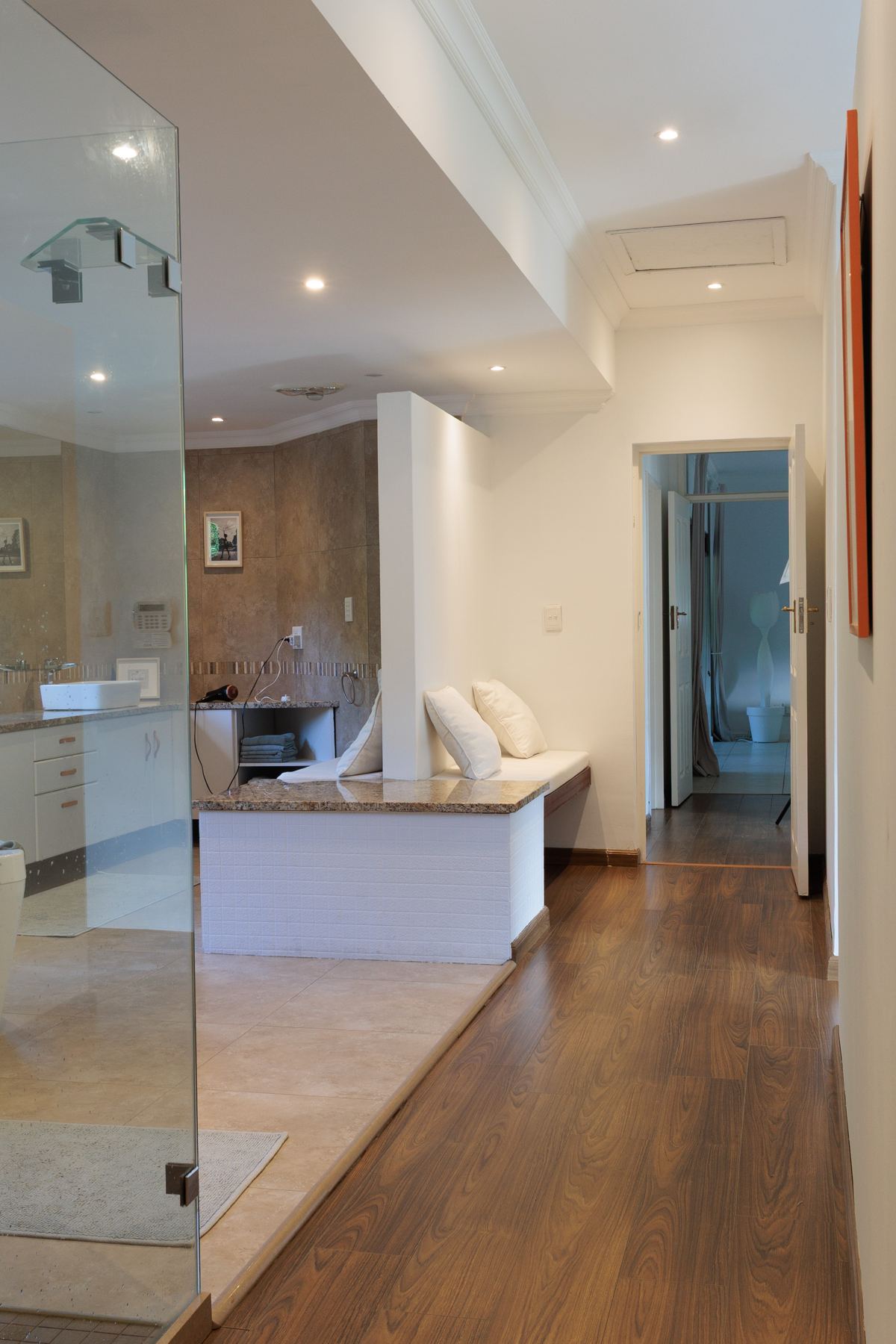 Main bathroom with a glass shower and timber floor