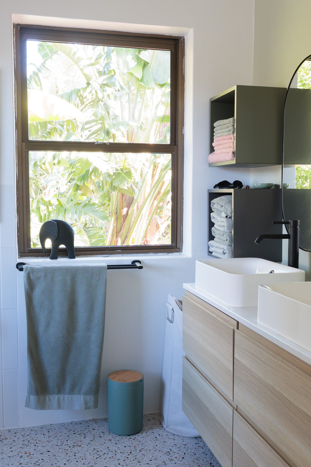 Upstairs bathroom with a timber vanity and window