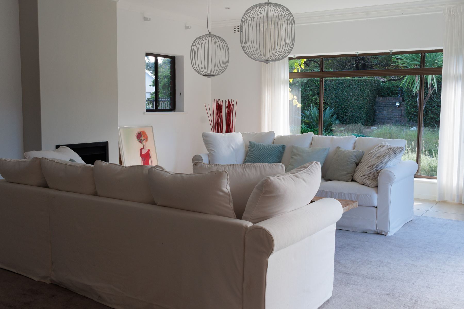 Lounge with a corner sofa and a garden window
